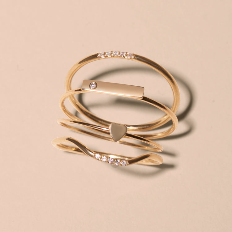 Still life image of Teeny Heart Ring with Stone and Strand solid gold jewelry