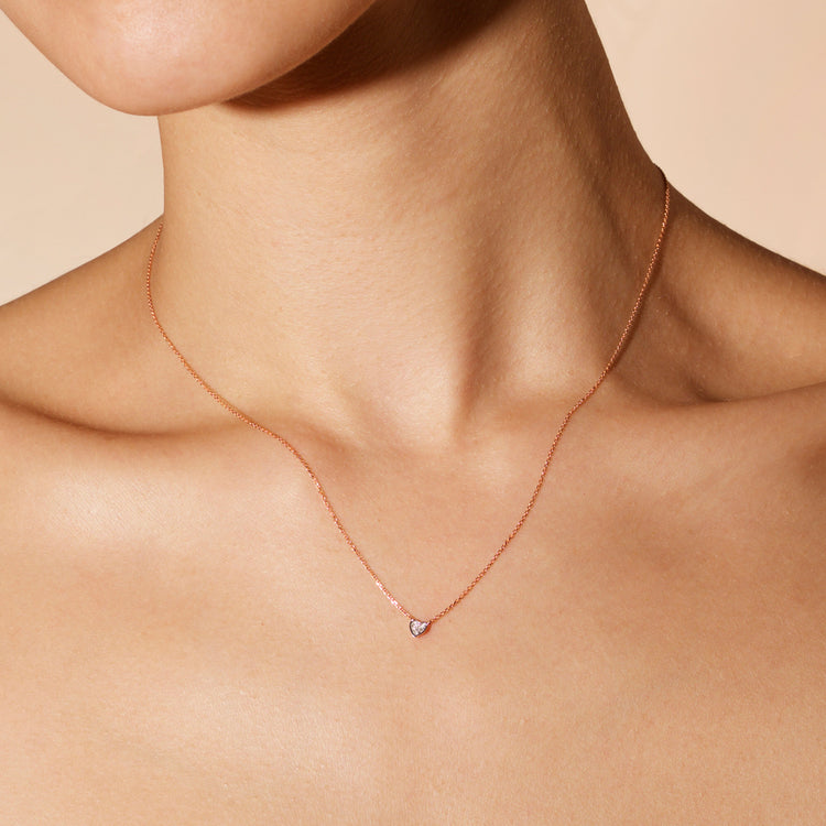 Image of 14K Yellow Gold Teeny Pave Heart Necklace on Models Neck