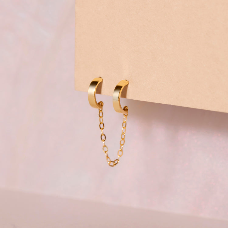 Stone and Strand 10K Yellow Gold Teeny Tiny Double Huggie Editorial Image