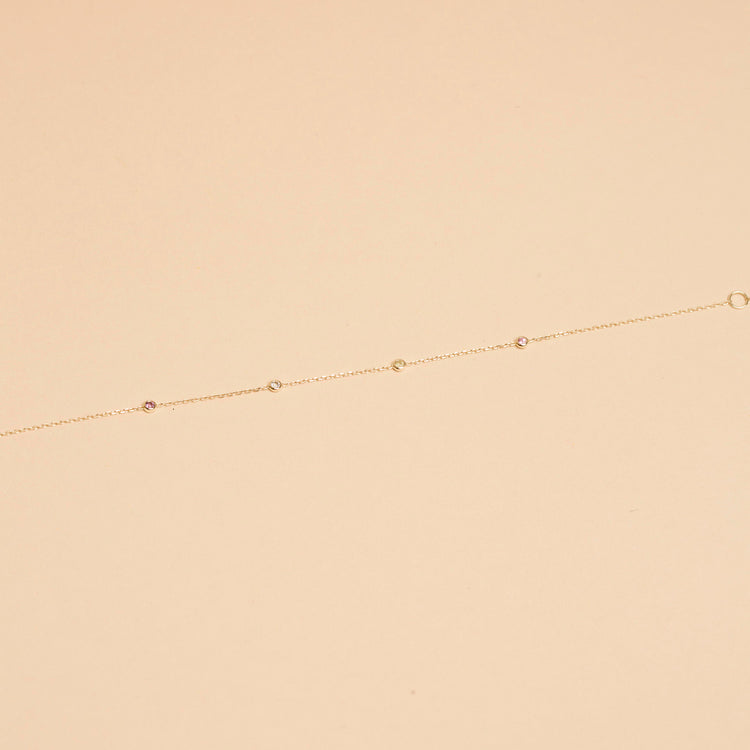 Stone and Strand 14K Yellow Gold Teeny Unicorn Gemstone Quartet Bracelet Editorial Image