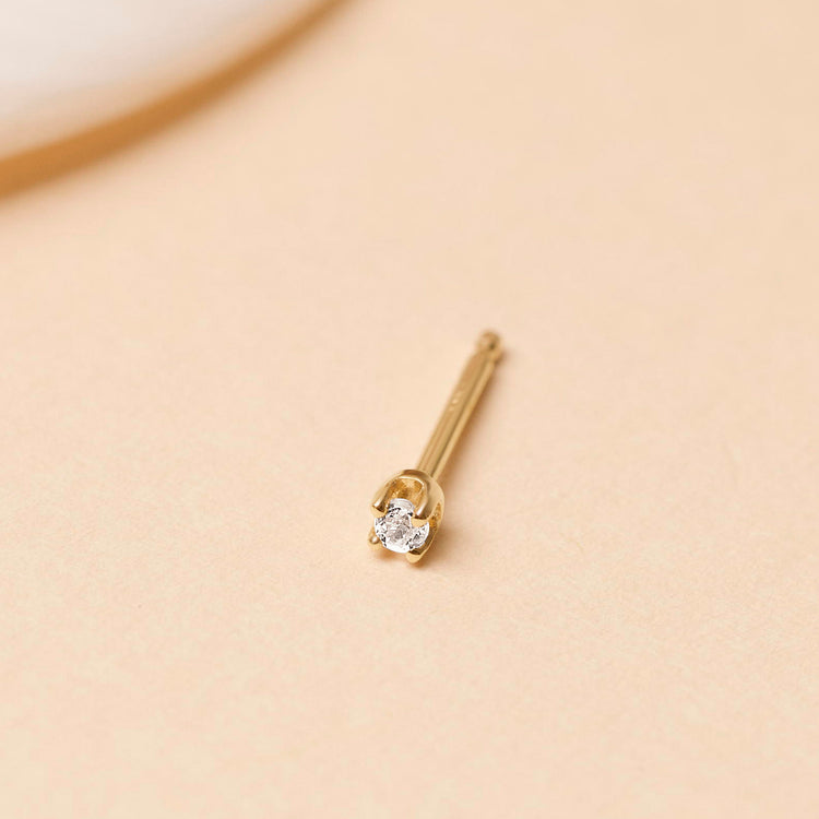 Stone and Strand 14K Yellow Gold Teeny White Topaz Stud Editorial Image