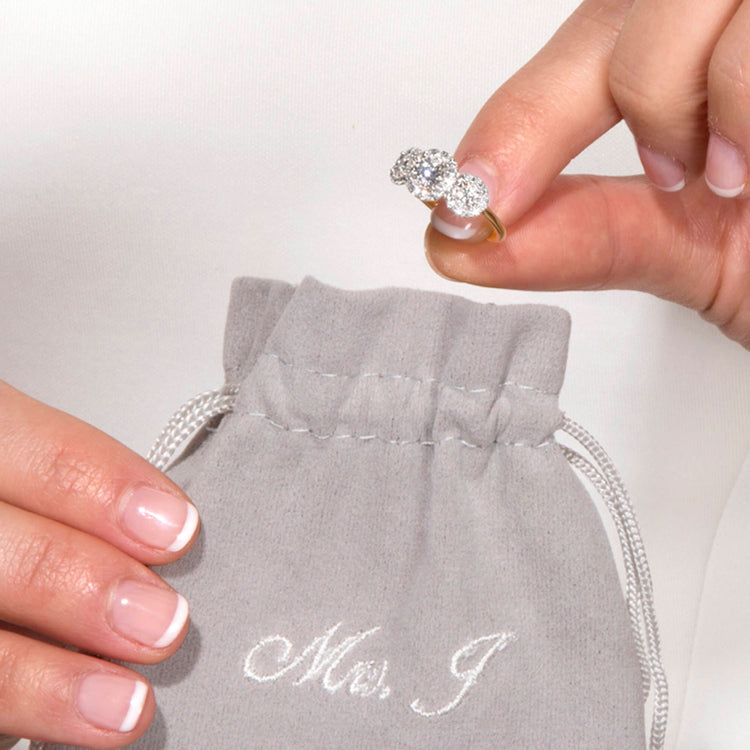 Still life image of The Josephine Ring In Yellow Gold with Stone and Strand jewelry bag