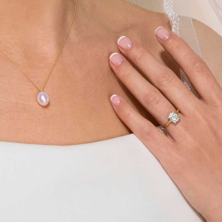 Model wearing The Sophia Ring In Yellow Gold with solid gold Stone and Strand jewelry