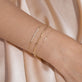 Image of 14K Yellow Gold Tiny Diamond Cross Bracelet with Stone and Strand Bracelets