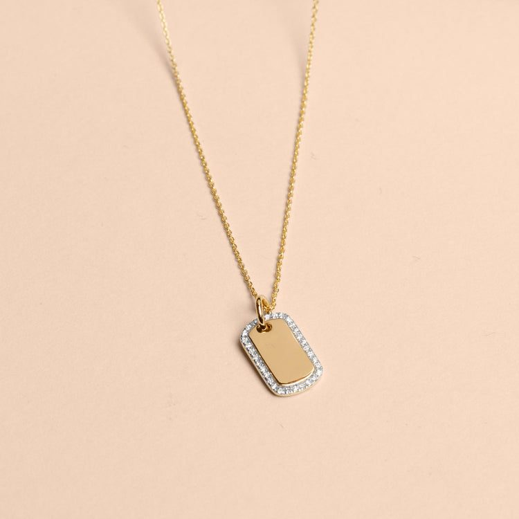 Stone and Strand 10K Yellow Gold Tiny Diamond Dog Tag Editorial Image