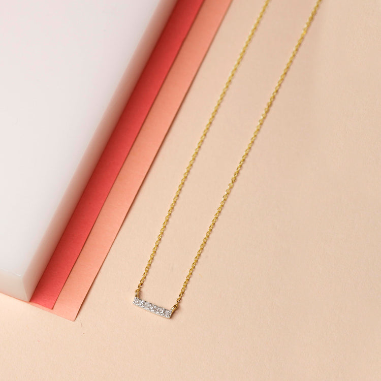 Stone and Strand 14K Yellow Gold Tiny Pave Diamond Bar Necklace Editorial Image