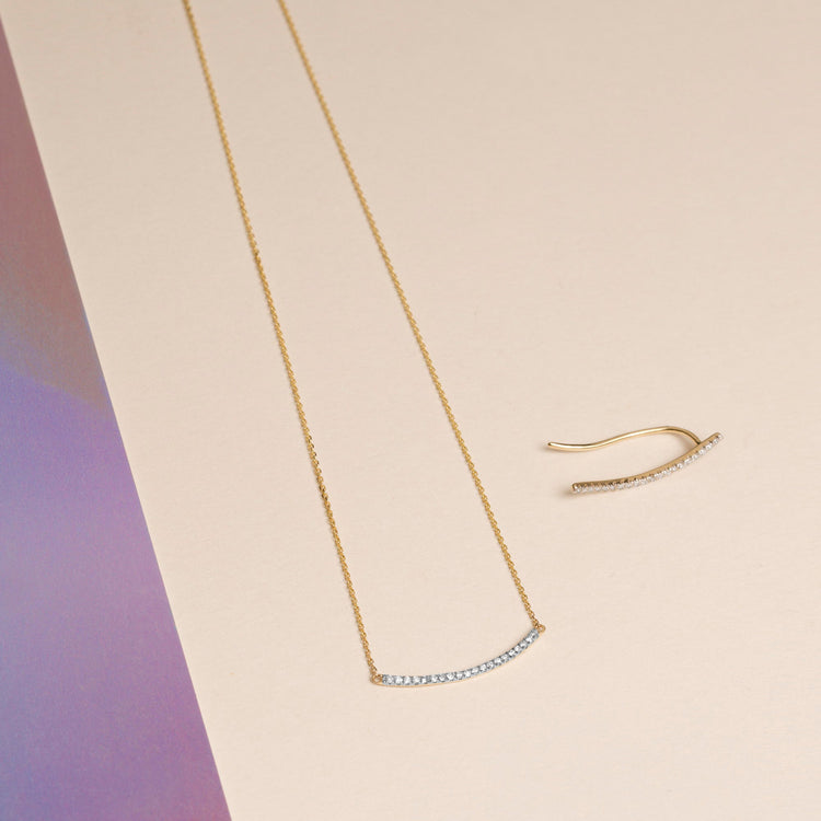 Still life image of Tiny Pave Diamond Curve Bar Necklace with Stone and Strand solid gold jewelry