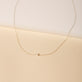 Stone and Strand 14K Yellow Gold Tiny Solitaire Pearl Necklace Editorial Image