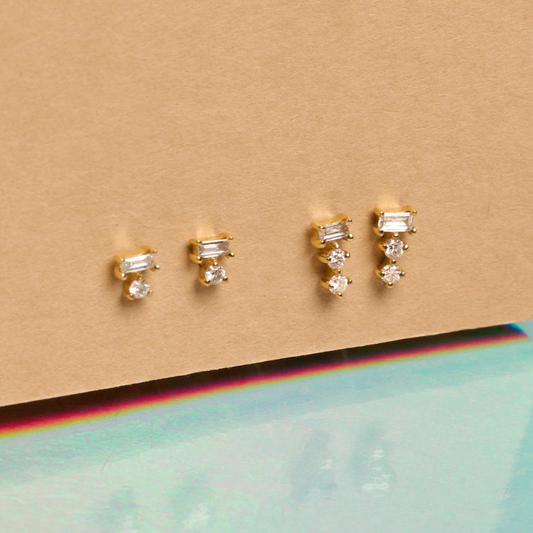 Still life image of Tiny Triple Stacked Diamond Studs with Stone and Strand solid gold jewelry