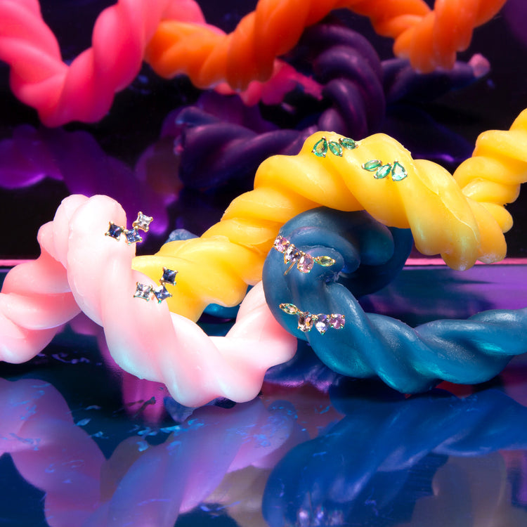 Still life image of True Blue Sapphire Climbers with Stone and Strand solid gold jewelry