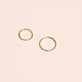 Still life image of Dainty Wavy Clicker Ring with Stone and Strand solid gold jewelry
