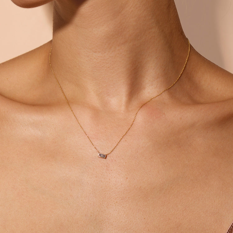 Image of 14K Yellow Gold Small Baguette Diamond Necklace on Models Neck