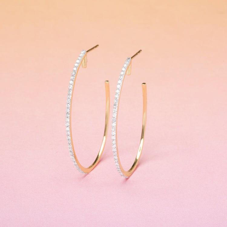 Stone and Strand 10K Yellow Gold Large Pave Oval Hoop Diamond Earrings Editorial Image