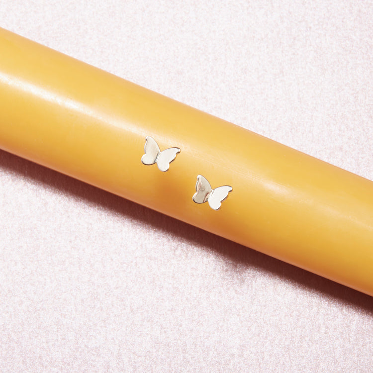 Stone and Strand 10K Yellow Gold Butterfly Studs Editorial Image