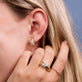 Model wearing Le Grande Cupola Diamond Huggies with solid gold Stone and Strand jewelry