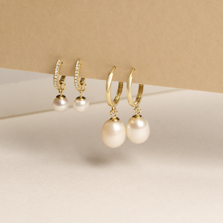 Still life image of Elliptical Pearl Huggies with Stone and Strand solid gold jewelry