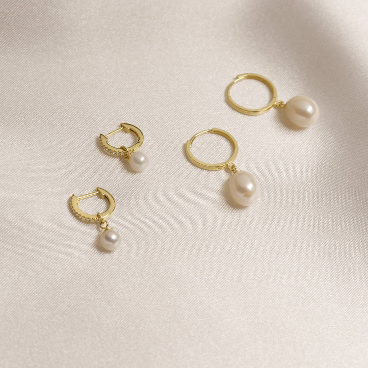 Still life image of Freshwater Droplet Pearl Pave Diamond Huggies with Stone and Strand solid gold jewelry