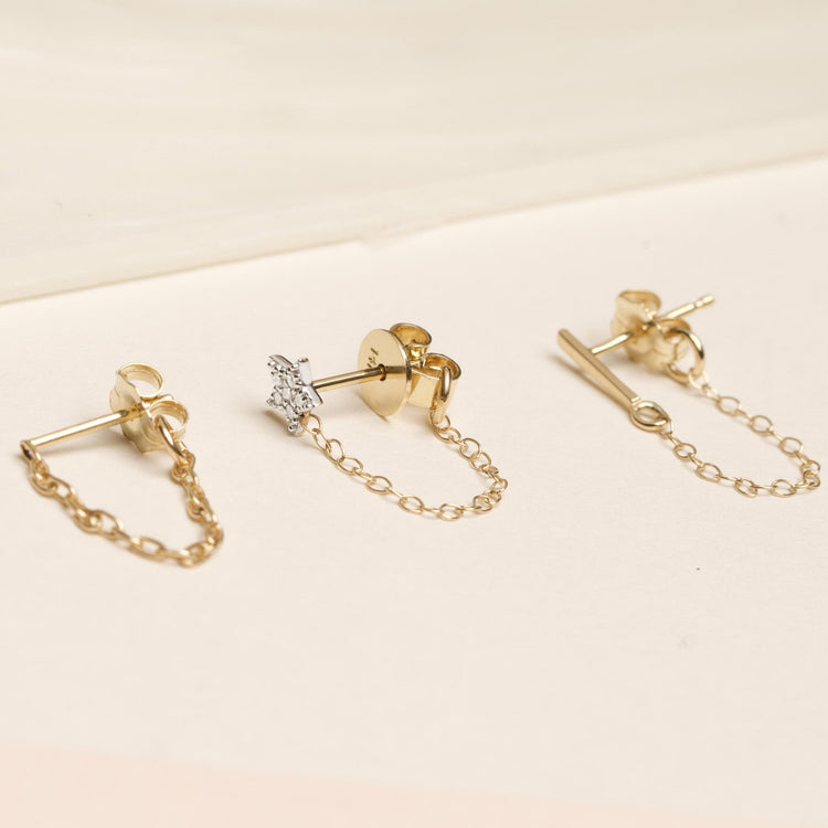 Still life image of Gold Front To Back Chain Earring with Stone and Strand solid gold jewelry