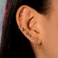 Image of 10K Yellow Gold Second Hole Teeny Unicorn Huggie with Stone and Strand Earrings